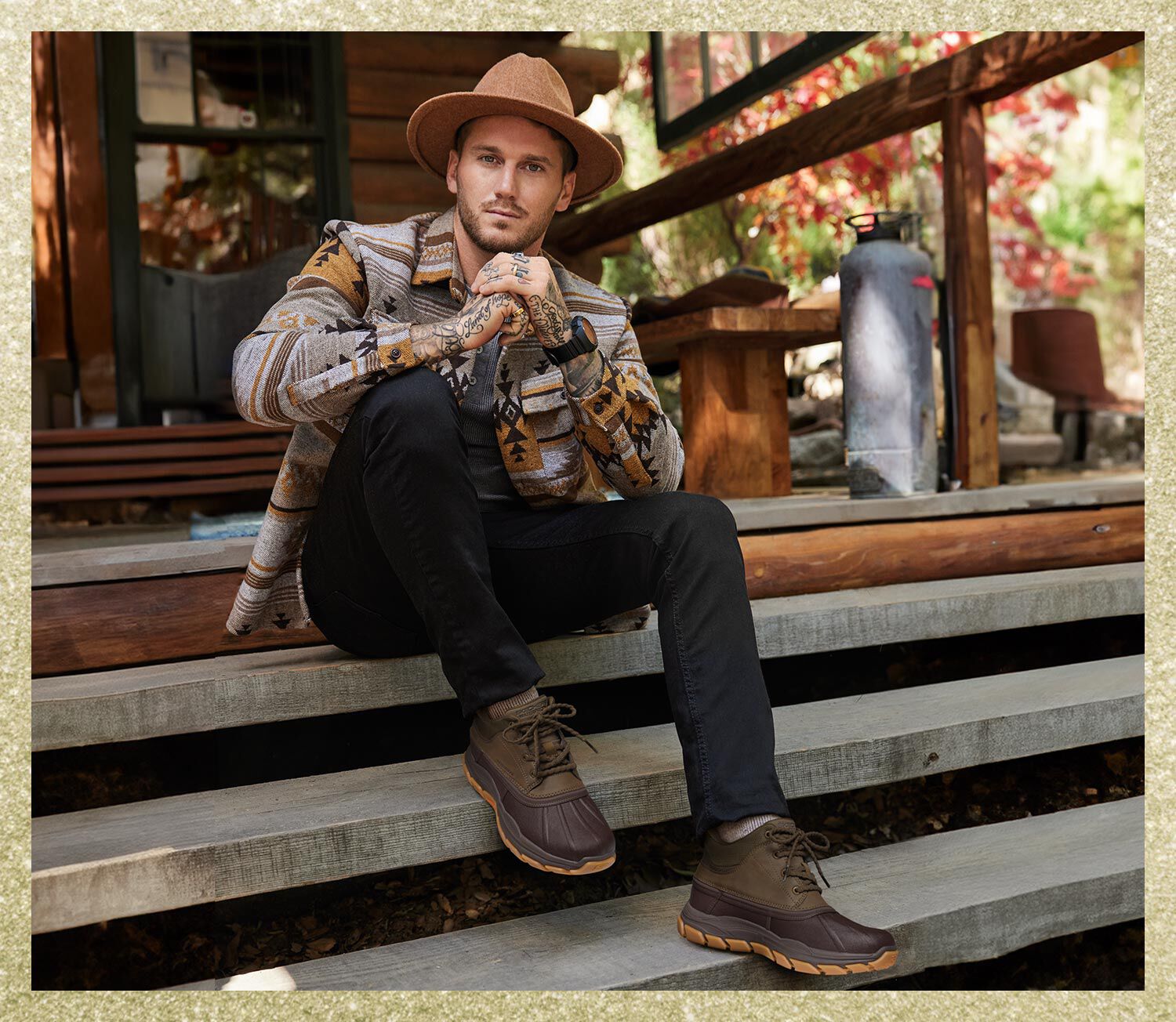 Man sitting on steps with Skechers shoes